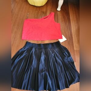 Red One-Shoulder Top and Black Pleated Skirt